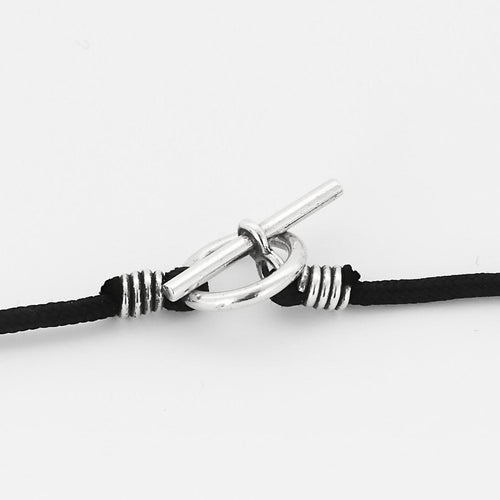 Pendentif Hermès Chaîne d'Ancre - Pendentif rond en argent et cordelière en coton noir 58 Facettes 58FC38