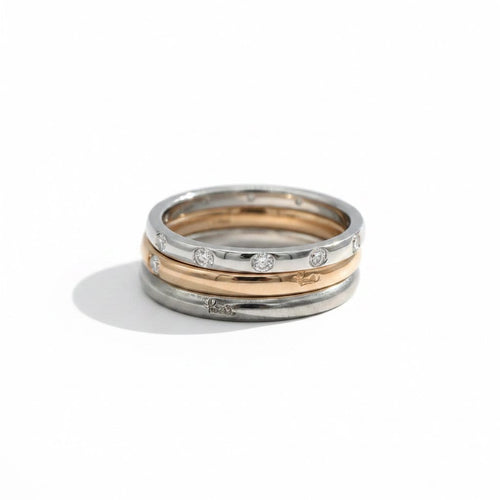 Bague 55 Pomellato Lucciole - Trio de bagues en titane, or rose et or blanc avec diamants 58 Facettes 1.0001455/1