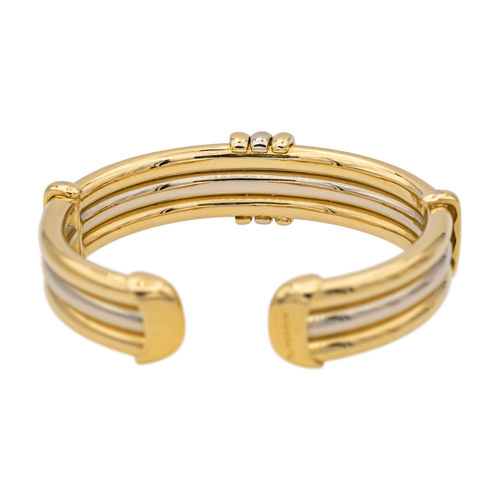 Bracelet O.J. Perrin - Bracelet rigide bicolore en or jaune et blanc 58 Facettes 1050174CN