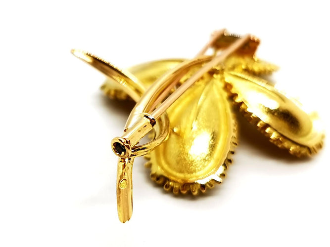 Broche Broche fleur vintage en or jaune 18 carats rubis et diamants 58 Facettes 1089906CD