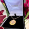 Pendentif Pendentif rond en or 14 k avec grenats et perles 58 Facettes BFC385526BB34B57A5D1C79A52B3ECBD