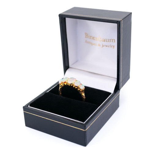 Bague 55 Bague cinq pierres en or jaune 18 carats et opales 58 Facettes 3613F170ED024DF7983473E9C4472394