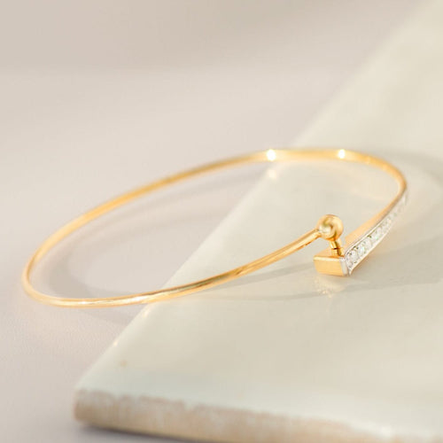 Armreif en or jaune 18 carats avec 12 diamants 58 Facettes