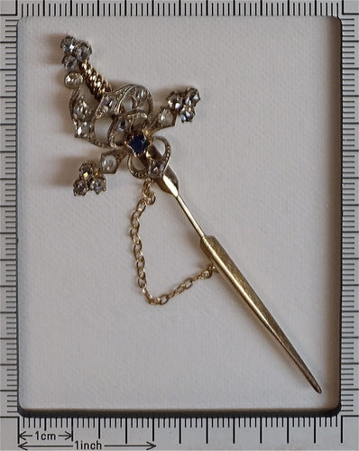 Broche Broche épée vintage en or rouge 18k, argent, diamants et saphir 58 Facettes 21309-0733