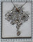 Pendentif Belle Époque - Broche-pendentif convertible nœud en platine et diamants 58 Facettes 22152-0220