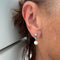 Boucles d'oreilles Boucles d’oreilles Art déco pendantes en or blanc 18 kt, perles et diamants 58 Facettes 23571