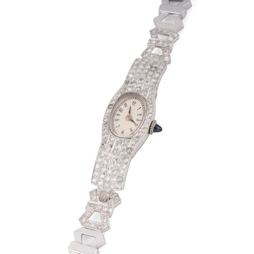 Montre Montre Art Déco ovale en platine et diamants 2,50 cts 58 Facettes 1