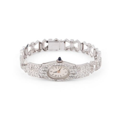 Montre Montre Art Déco ovale en platine et diamants 2,50 cts 58 Facettes 1
