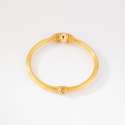 Bracelet Lalaounis - Bracelet jonc ciselé en or jaune 22K 58 Facettes 1