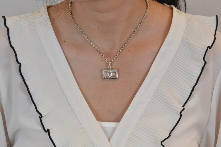 Collier Hermès - Collier en argent avec pendentif 58 Facettes 26908dv