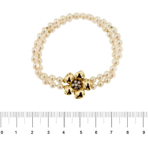 Bracelet Bracelet double rang de perles et diamants en or jaune 18 carats 58 Facettes 27351