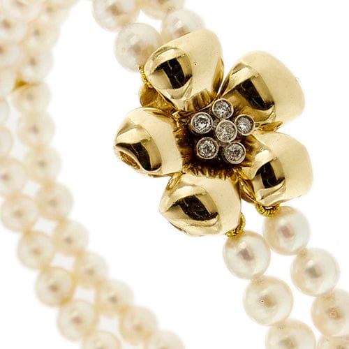 Bracelet Bracelet double rang de perles et diamants en or jaune 18 carats 58 Facettes 27351