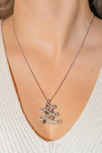 Collier Collier pendentif sapin en or blanc 18 carats, saphirs et diamants 58 Facettes 2820739CN