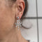 Boucles d'oreilles Boucles d’oreilles pendantes chandelier en or blanc 18 kt et diamants 58 Facettes 33777O