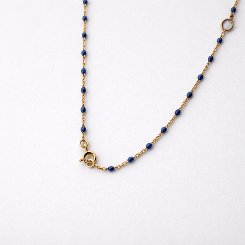 Collier Collier en or jaune 18 carats avec perles et topazes bleues 58 Facettes 34651