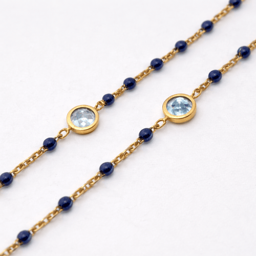 Collier Collier en or jaune 18 carats avec perles et topazes bleues 58 Facettes 34651