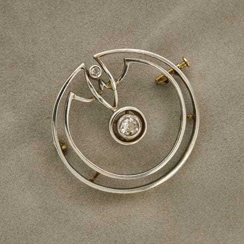 Broche Broche Art déco ronde en or jaune et blanc 18 carats avec diamants 58 Facettes 35599