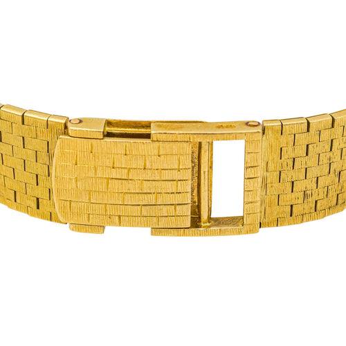 Montre Zenith/Movado - Montre en or jaune 18 carats œil de tigre 58 Facettes 3810565CN