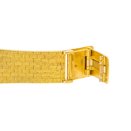Montre Zenith/Movado - Montre en or jaune 18 carats œil de tigre 58 Facettes 3810565CN