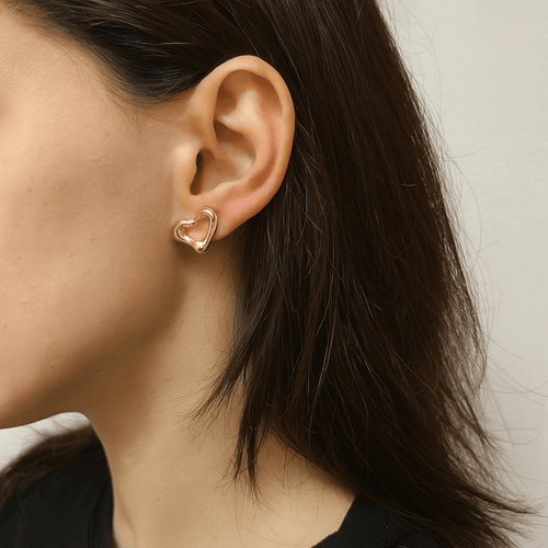 Boucles d'oreilles Tiffany & Co. Elsa Peretti - Boucles d’oreilles puces Open Heart en or jaune 18k 58 Facettes