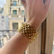 Bracelet Bracelet manchette vintage à maille fleurie souple 58 Facettes REF24083-246