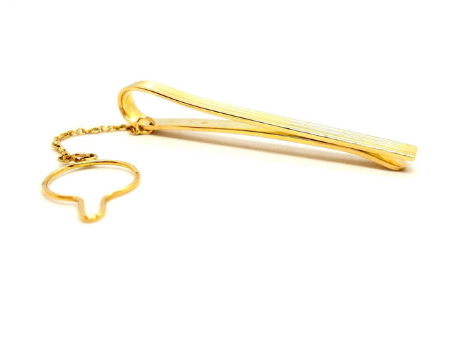 Broche Hermès - Pince à cravate en or jaune 18 carats 58 Facettes 720124CN