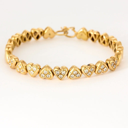 Bracelet Bracelet jonc "Cœurs" en or jaune et pierres blanches 58 Facettes DV0654-3