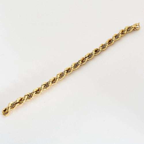 Bracelet Bracelet torsadé en or jaune et diamants 58 Facettes DV10645-1