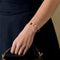 CARTIER - Amulette - Bracelet jonc ouvert en or rose, onyx, nacre et diamants