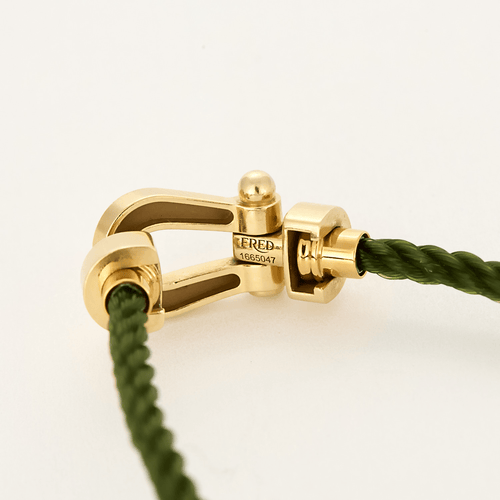 Bracelet FRED - FORCE 10 - Moyen modèle - Bracelet en or jaune et cordon torsadé en acier vert 58 Facettes DV18445-7