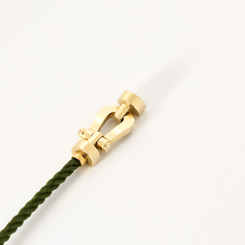 Bracelet FRED - FORCE 10 - Moyen modèle - Bracelet en or jaune et cordon torsadé en acier vert 58 Facettes DV18445-7