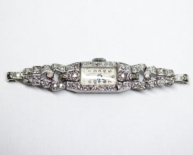 Montre Montre Art Déco en platine pavée de diamants 58 Facettes A11302