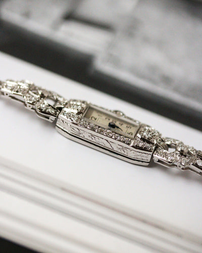 Montre Montre Art Déco en platine pavée de diamants 58 Facettes A11302