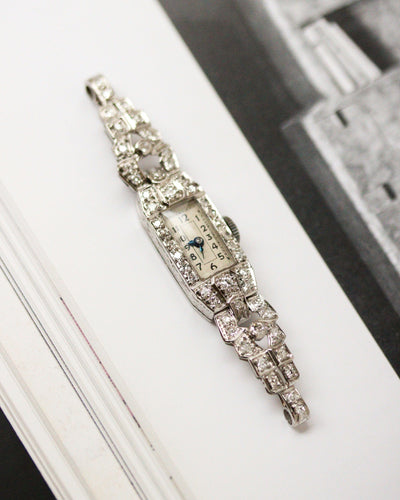 Montre Montre Art Déco en platine pavée de diamants 58 Facettes A11302
