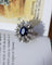 Bague 54 Bague Pompadour en or blanc et platine, saphir ovale et diamants 58 Facettes A11803