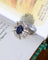 Bague 54 Bague Pompadour en or blanc et platine, saphir ovale et diamants 58 Facettes A11803
