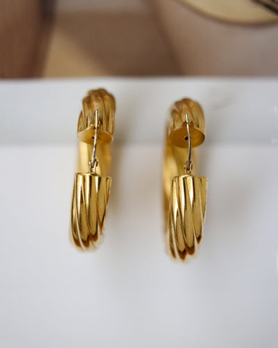 Boucles d'oreilles Boucles d’oreilles créoles motif torsadé en or jaune 750 58 Facettes A11887