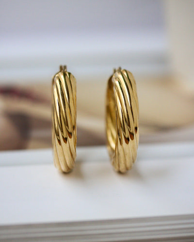 Boucles d'oreilles Boucles d’oreilles créoles motif torsadé en or jaune 750 58 Facettes A11887