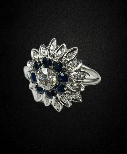 Bague Bague fleur étoilée années 1960 avec diamant, saphirs et diamants 58 Facettes