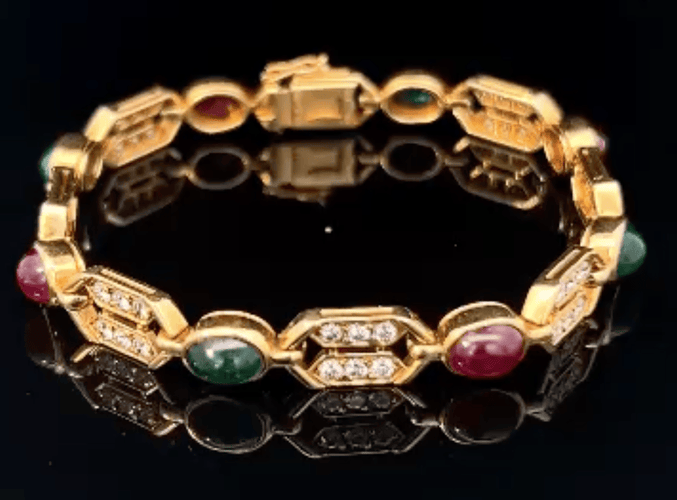 Bracelet OJ Perrin bracelet in 18k yellow gold, diamonds, cabochon emeralds and rubies 58 Facettes 58F19