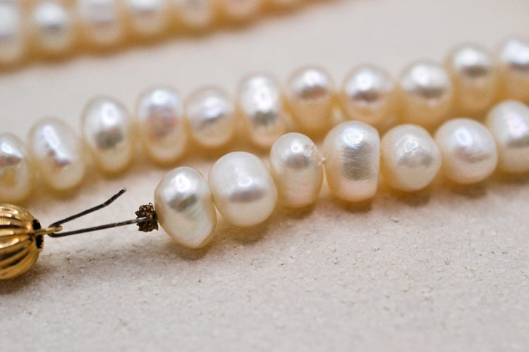 Collier Collier de perles de culture oblongues en or jaune 18 carats 58 Facettes 3791