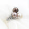 Bague Bague en or blanc 18 kt avec perles et diamants 58 Facettes 5505
