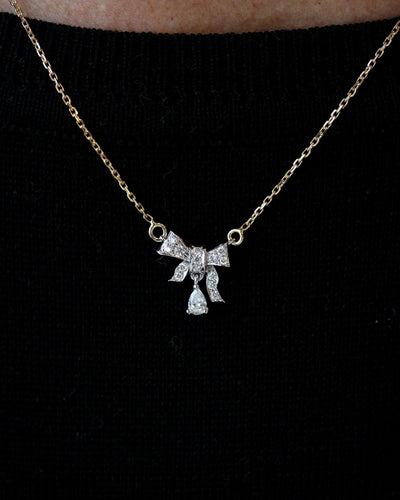 Pendentif Pendentif nœud style art déco pavé de diamants en or blanc et jaune 58 Facettes F1969