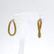 Boucles d'oreilles Créoles ovales torsadées en or 18K texturé 58 Facettes REF2563-331