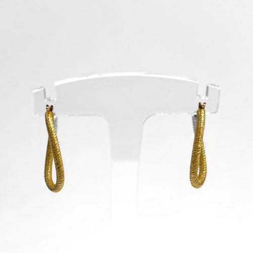 Boucles d'oreilles Créoles ovales torsadées en or 18K texturé 58 Facettes REF2563-331