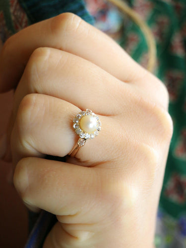 Bague 53 Bague marguerite ancienne en or rose 18 carats, perle et diamants 58 Facettes 1174.5