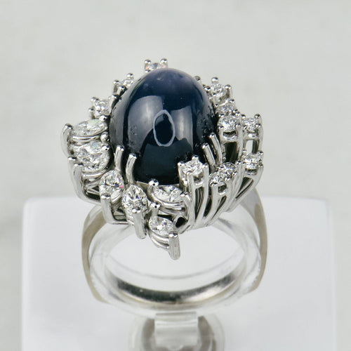 Bague 53.5 Bague en or blanc 750 avec saphir étoilé et diamants 58 Facettes 1864