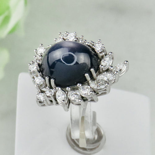 Bague 53.5 Bague en or blanc 750 avec saphir étoilé et diamants 58 Facettes 1864