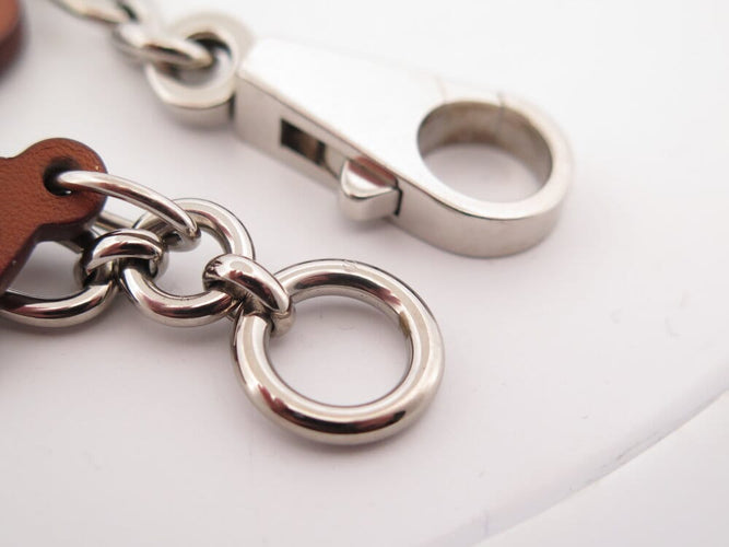 Bracelet Hermès Olga Amulette - Bracelet en cuir Barenia et acier palladié 58 Facettes 265386