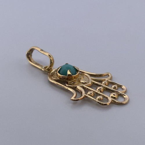 Pendentif Pendentif main de Fatma en or jaune 18 carats et turquoise 58 Facettes 250186